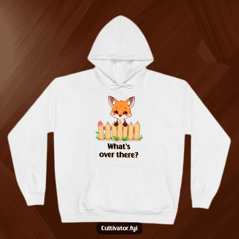 Funny hoodie depicting a curious fox peeking excitedly over a tiny garden fence, designed for comfort and laughs.
